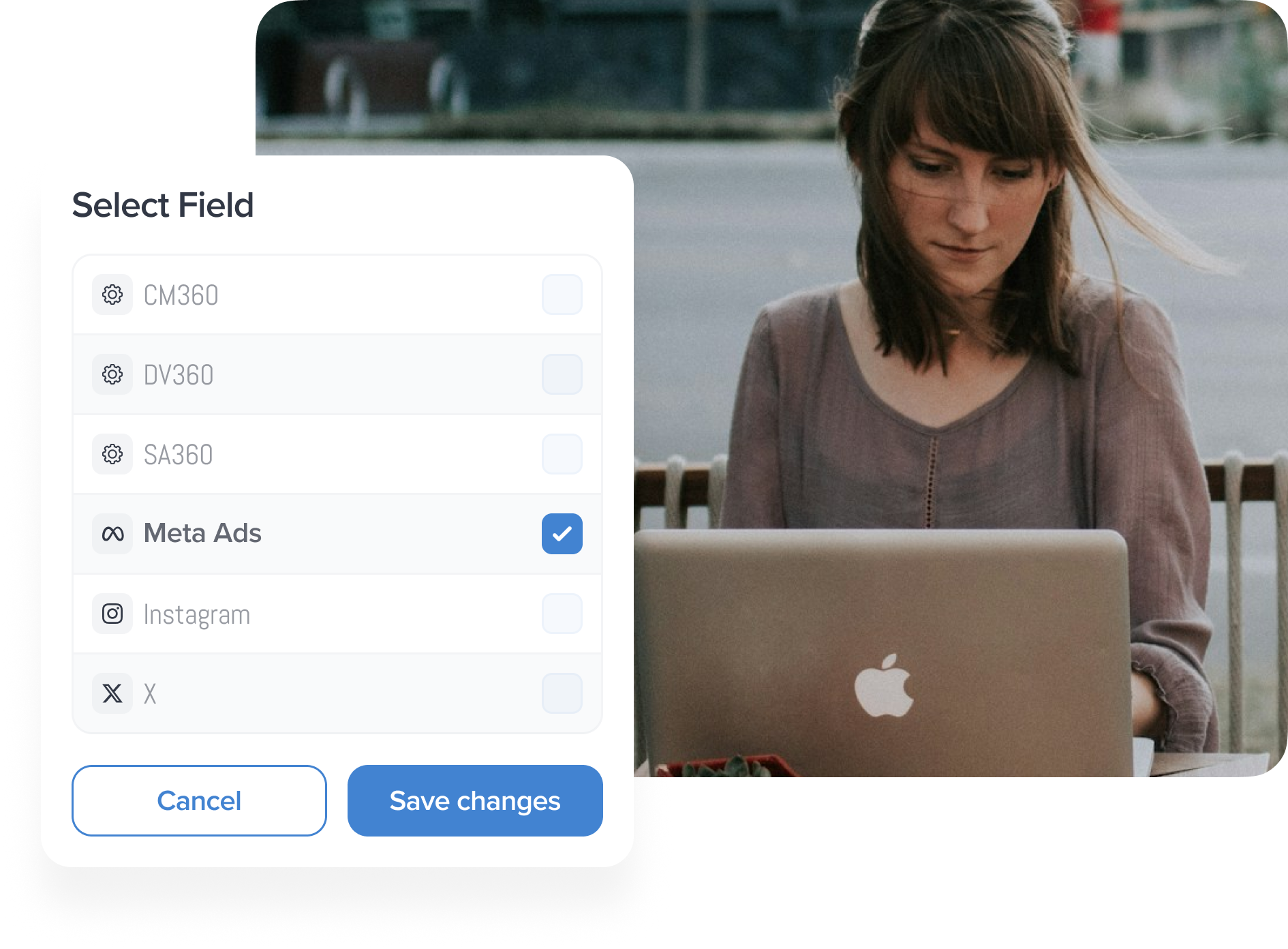 select field from list, woman sitting outside and typing on laptop